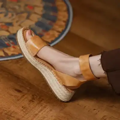 Comfortable tan leather wedge sandals with ankle straps, perfect for casual or summer wear, featured on Monalisa Medical's online store.