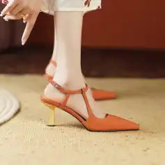 Elegant orange high heels for women featuring pointed toe and ankle strap, perfect for fashion-forward occasions. Crafted with quality materials, these shoes combine style and comfort.