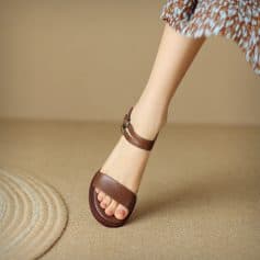 Stylish brown leather sandals with ankle strap, perfect for comfortable and fashionable footwear. Ideal for casual and formal occasions, enhancing every woman's wardrobe with quality craftsmanship.