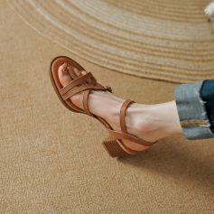 High-quality tan sandal with adjustable straps, perfect for fashion-forward women seeking comfort and elegance. Ideal for summer outfits and casual occasions.