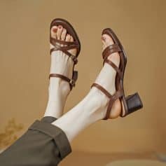 Stylish brown leather sandals for women and men with comfortable block heels, perfect for everyday wear and outdoor activities.