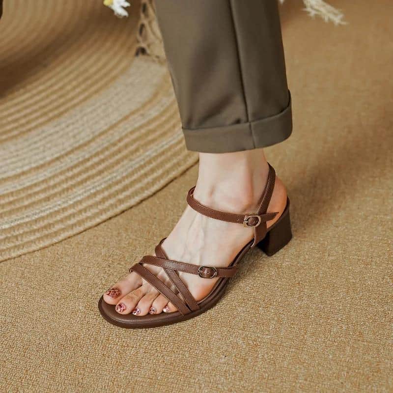 Elegant brown leather heeled sandals for women, perfect for casual or formal occasions, offering comfort and style.