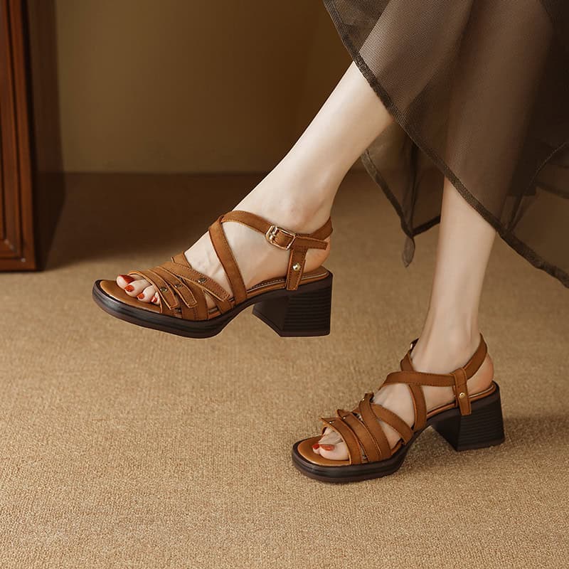 Elegant women’s brown leather platform heels with adjustable ankle strap, showcasing modern foot fashion and comfortable design.