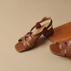 Stylish brown leather women’s sandals with ankle straps and block heels, perfect for summer outfits and casual occasions. High-quality footwear offering comfort and durability.