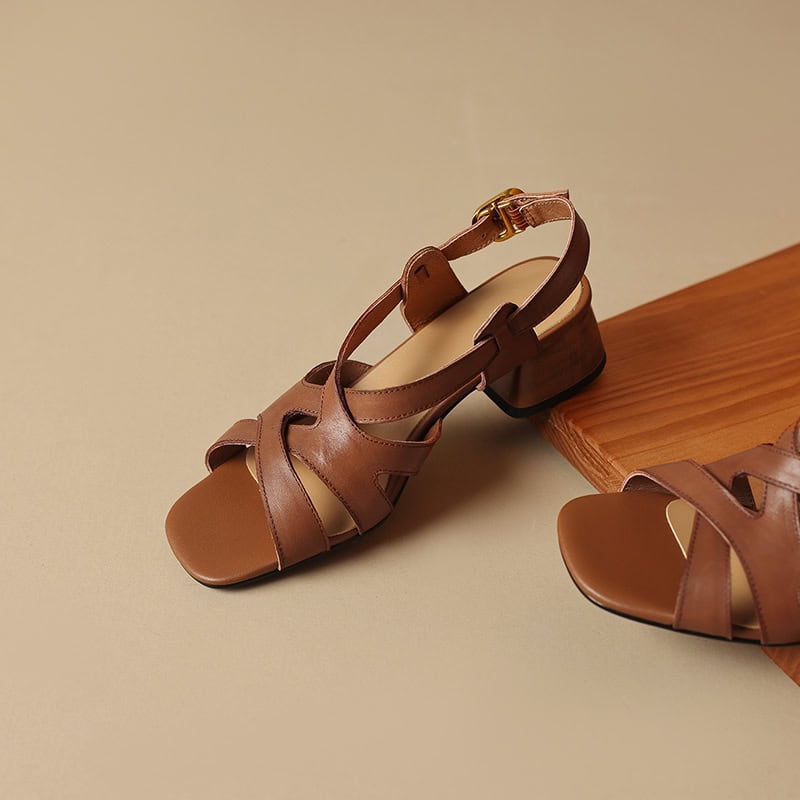 Stylish brown leather women’s sandals with ankle straps and block heels, perfect for summer outfits and casual occasions. High-quality footwear offering comfort and durability.