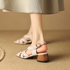 Comfortable women's beige block heel sandals with ankle straps for stylish outings and casual wear.