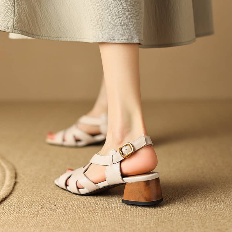 Comfortable women's beige block heel sandals with ankle straps for stylish outings and casual wear.