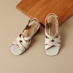 Stylish white women's sandals with open toe and ankle strap for comfort and fashion. Perfect for summer, casual, and formal wear, these versatile shoes enhance your wardrobe.