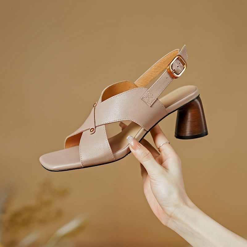 Stylish beige leather women’s sandal with chunky heel and adjustable ankle strap, perfect for fashion-forward looks and special occasions.