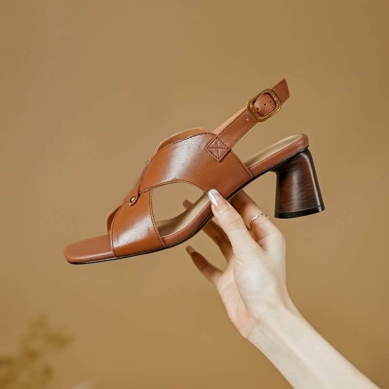 Elegant brown leather sandal with heel, perfect for stylish summer footwear and comfortable wear. Ideal for women seeking trendy and versatile shoes.