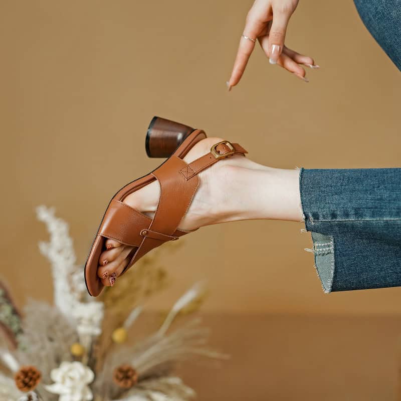 Comfortable brown sandal with a block heel, perfect for casual and dressy occasions. Features adjustable strap for a secure fit.