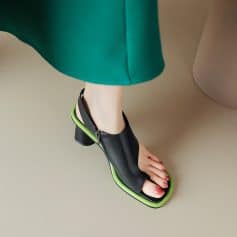 Stylish black and neon green open-toe sandal with a block heel for modern fashion. Perfect for trendy outfits and comfort.