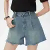 Comfortable high-waisted denim shorts with frayed hem, perfect for summer and casual wear. Stylish and versatile for everyday outfits.