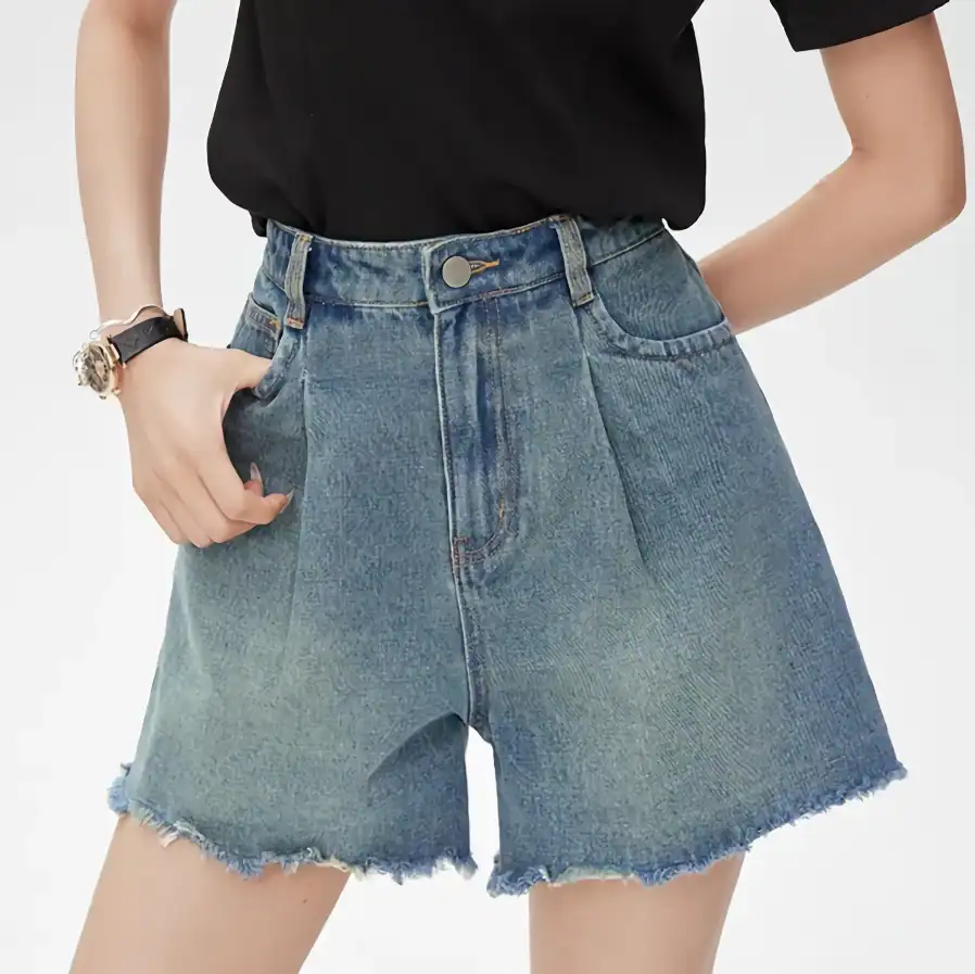 Comfortable high-waisted denim shorts with frayed hem, perfect for summer and casual wear. Stylish and versatile for everyday outfits.