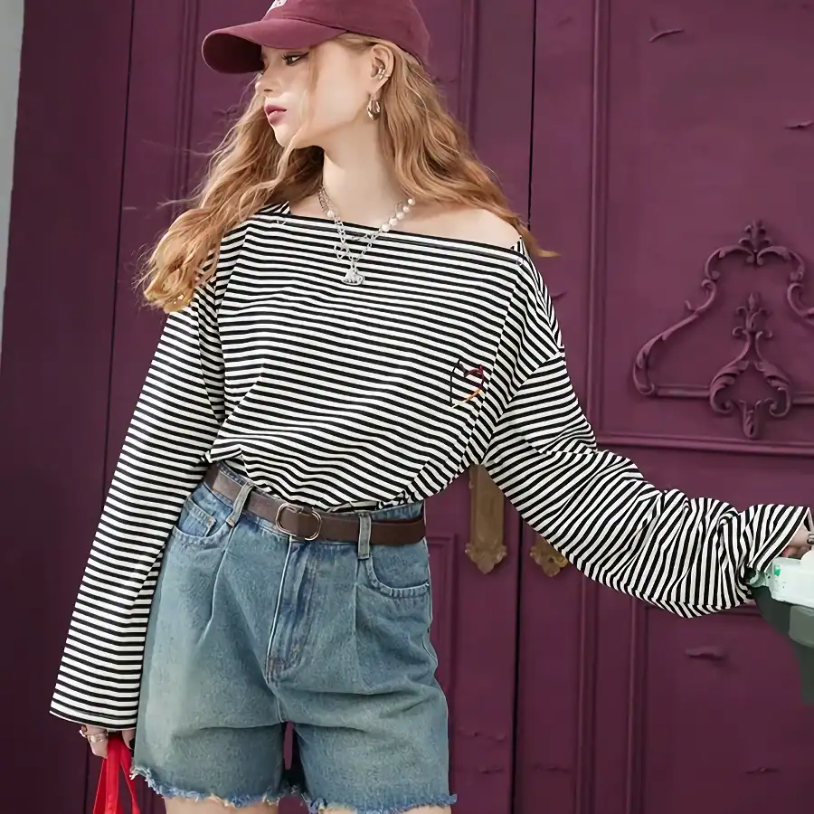 Elegant striped casual top with off-shoulder design, perfect for trendy and comfortable fashion. Ideal for everyday wear and stylish outings.