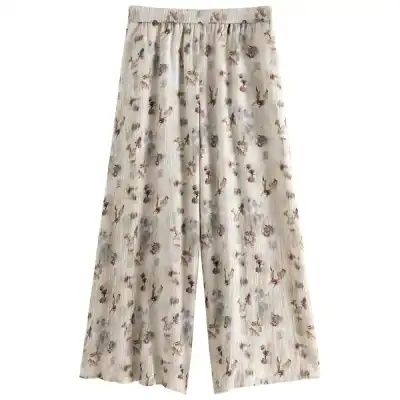 Elegant floral wide-leg trousers for women, perfect for casual or dressy occasions, made from lightweight, comfortable fabric.
