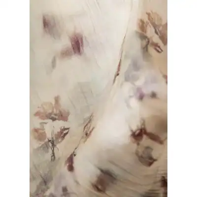 Close-up of floral-patterned eyeglass frame showcasing intricate design and craftsmanship for stylish eye wear.