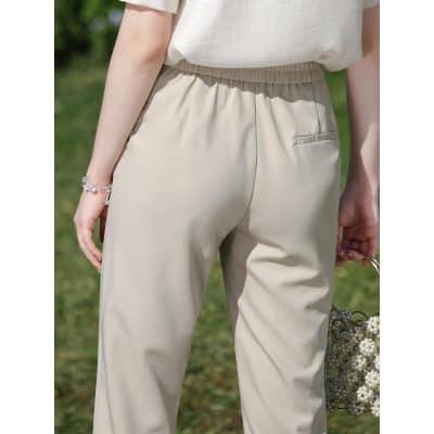 Comfortable beige women's casual pants with elastic waistband, perfect for everyday wear and outdoor activities.