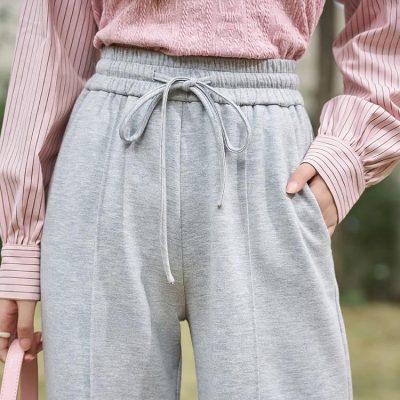 Stylish women's athleisure pants from Monalisa Store featuring a soft, comfortable fabric, drawstring waist, and relaxed fit for casual, everyday wear and active lifestyles.