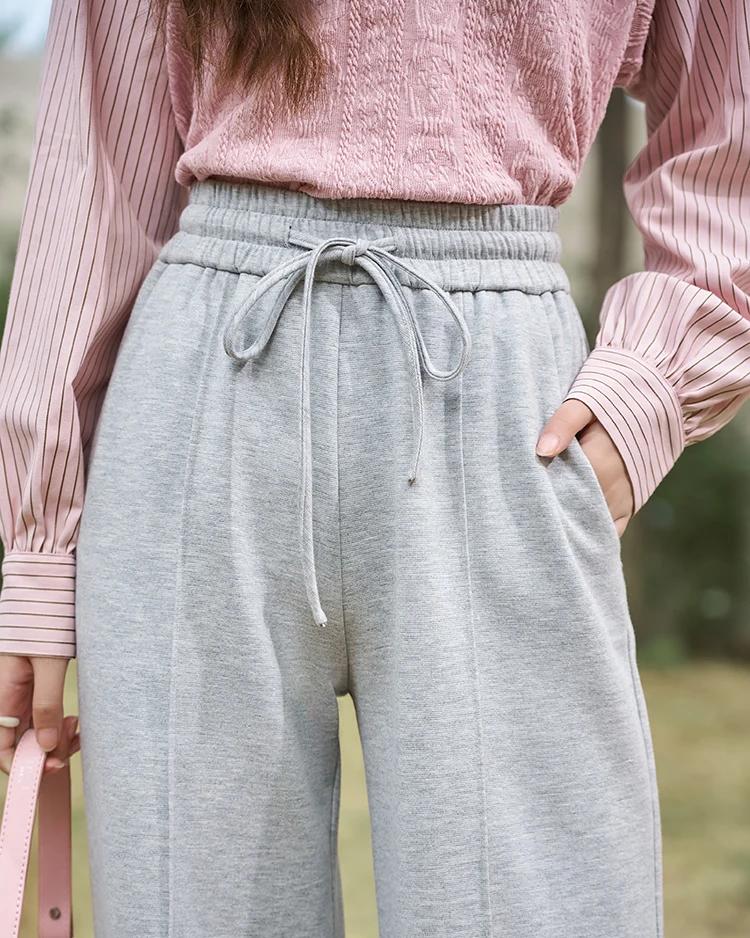 Stylish women's athleisure pants from Monalisa Store featuring a soft, comfortable fabric, drawstring waist, and relaxed fit for casual, everyday wear and active lifestyles.