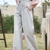 Comfortable women's lounge pants made from soft gray fabric, featuring an elastic waistband with a drawstring for a perfect fit, ideal for relaxation and everyday casual wear.