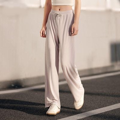 Casual beige wide-leg lounge pants perfect for relaxation and leisure activities, featuring an elastic waistband and soft fabric for all-day comfort.