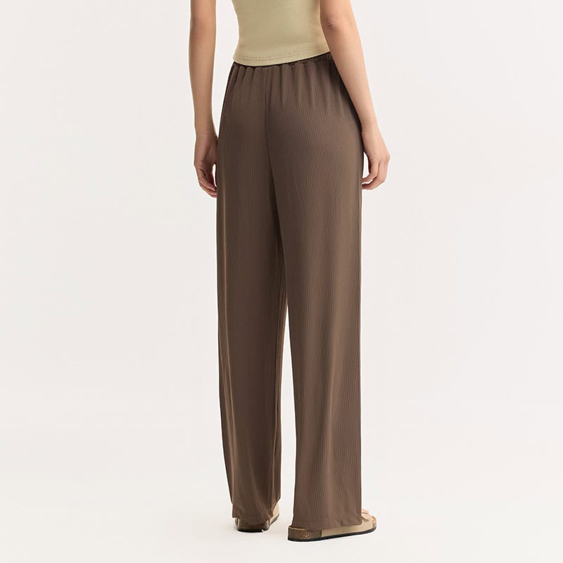 Stylish brown wide-leg trousers perfect for casual or professional wear, made from lightweight, comfortable fabric with a relaxed fit.