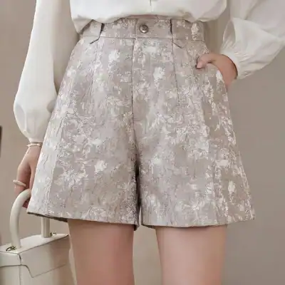 Versatile floral shorts in a chic beige and gold pattern, perfect for summer and casual outings, available at Monalisa Store for stylish comfort.