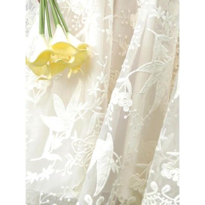 Delicate embroidered lace curtains featuring intricate patterns of birds and flowers, perfect for enhancing your living space with a touch of elegance and sophistication.