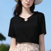 Elegant black casual top for women with a stylish keyhole neckline, perfect for everyday wear and outdoor outings. Comfortable fit, versatile fashion piece ideal for summer.