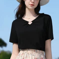 Elegant black casual top for women with a stylish keyhole neckline, perfect for everyday wear and outdoor outings. Comfortable fit, versatile fashion piece ideal for summer.