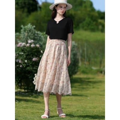 Elegant floral lace midi skirt paired with a black top, perfect for summer outings and outdoor events, available at Monalisa Store.