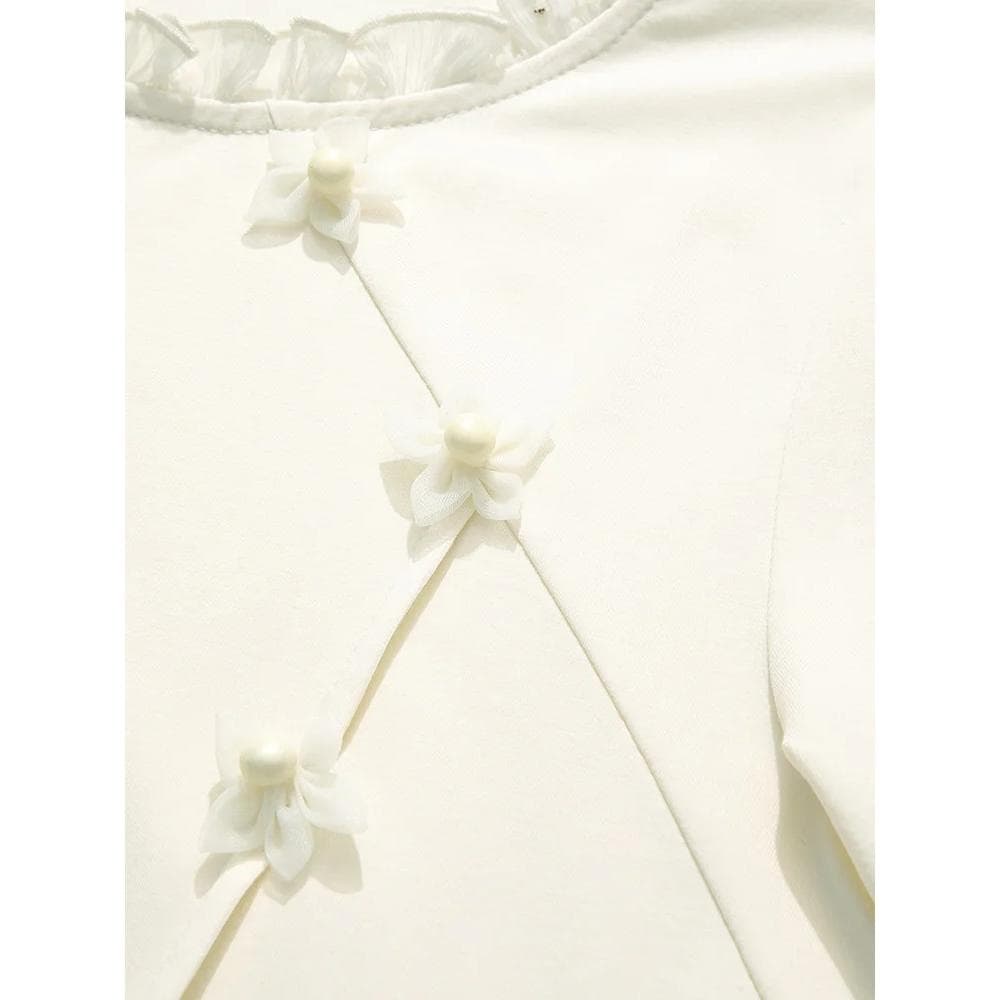 Optical style garment with delicate white fabric and flower embellishments, perfect for accessory or clothing detail. Enhances visual appeal in fashion and luxury wear collections.