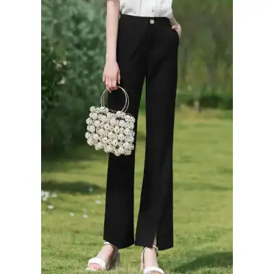 Stylish black wide-leg trousers for women, perfect for office or casual wear, with comfortable fit and versatile look.