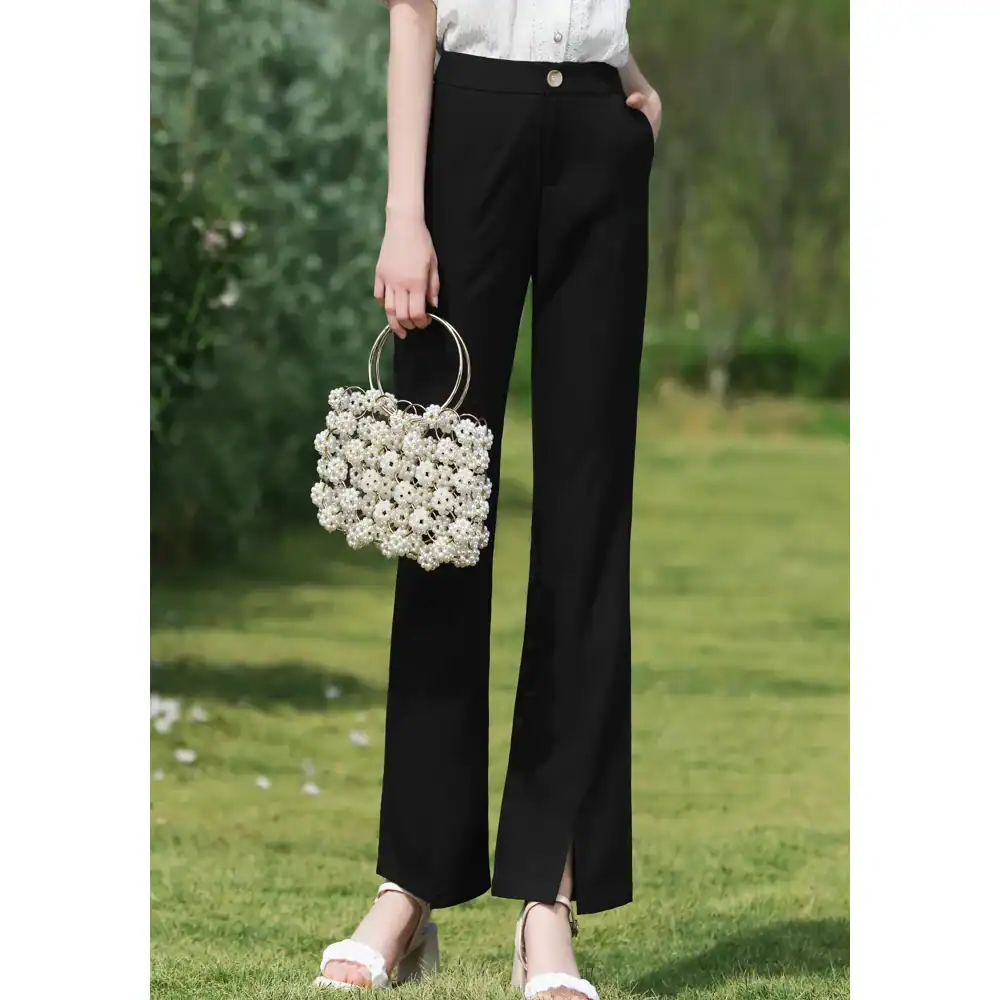 Stylish black wide-leg trousers for women, perfect for office or casual wear, with comfortable fit and versatile look.