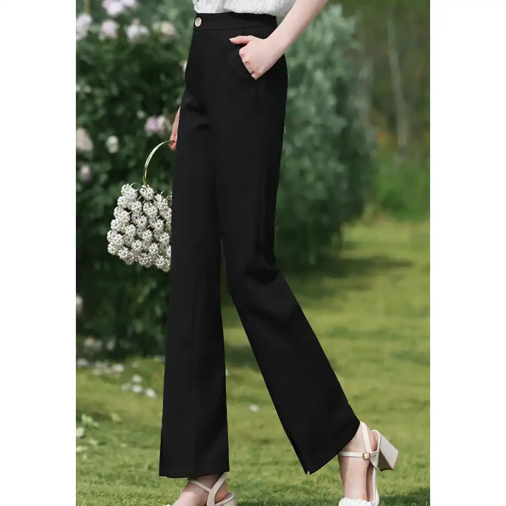 High-quality women's black wide-leg tailored trousers perfect for professional and casual wear. Comfortable fit with stylish design, ideal for office and leisure outfits.
