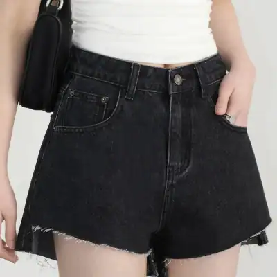 Modern black denim shorts featuring raw hem, high waist, and classic five-pocket design, ideal for casual and trendy summer looks.