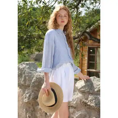 Ethereal blue striped blouse and white shorts, perfect for summer fashion, outdoor photoshoot, and casual wear. Featured at Monalisa Store, ideal for trendy and comfortable women's apparel collection.
