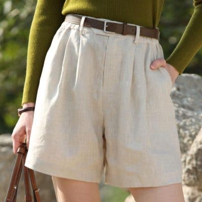 Elegant beige women's shorts for casual or outdoor wear, featuring a tailored fit, belt loops, and comfortable fabric for everyday style. Perfect for summer outings.