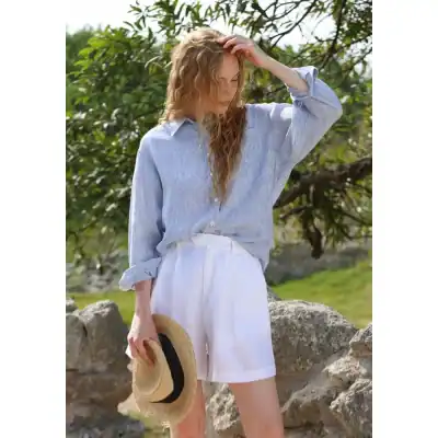 Comfortable women's linen shirt and white shorts, perfect for summer outdoor wear and beach vacations, available at Monalisa Store.