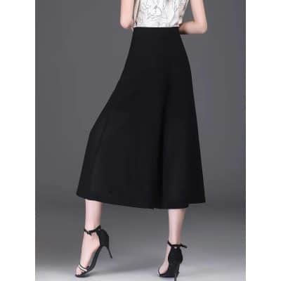 High-quality black wide-leg trousers perfect for fashionable women seeking comfort and style. Ideal for office wear, casual outings, or formal events with a chic silhouette.