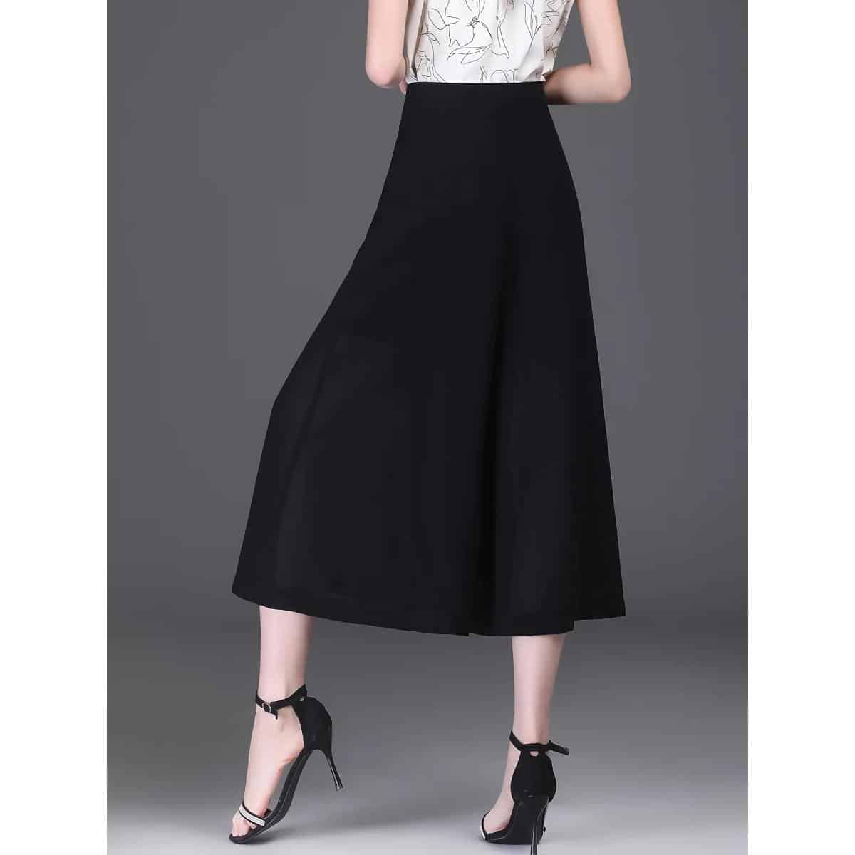 High-quality black wide-leg trousers perfect for fashionable women seeking comfort and style. Ideal for office wear, casual outings, or formal events with a chic silhouette.