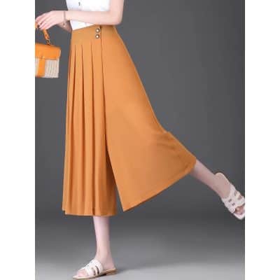 Bright orange high-waisted wide-leg trousers featuring pleats, side buttons, and a comfortable fit, perfect for fashion-forward women.