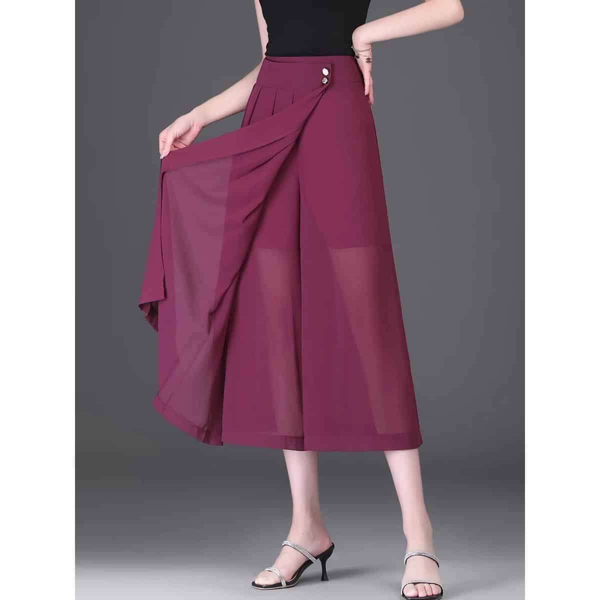 A stylish maroon wide-leg skirt featuring pleats and side buttons, perfect for office and casual wear. Made from lightweight, breathable fabric for all-day comfort.