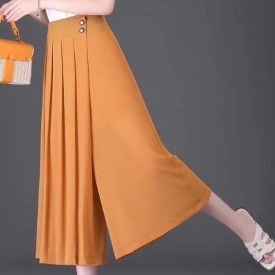 A stylish pair of orange high-waisted pleated wide-leg trousers perfect for any fashionable look. Made from comfortable fabric, ideal for casual or dressy occasions, complements various tops and footwear.