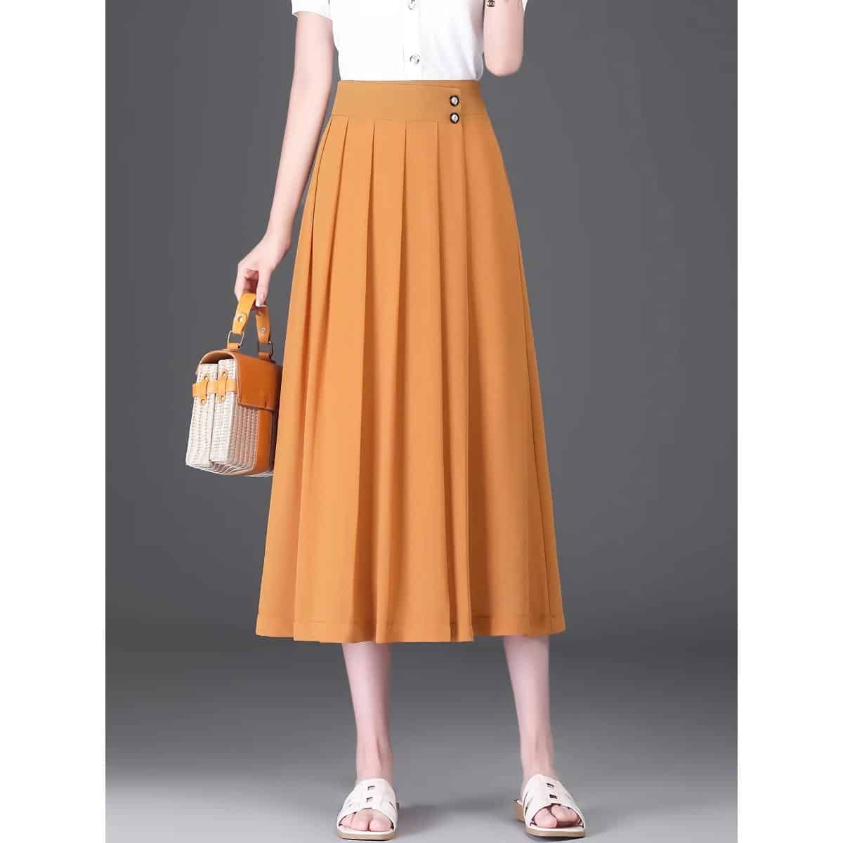 Elegant orange pleated maxi skirt for women, stylish and comfortable, perfect for casual or formal wear, available at Monalisa Medical Store.