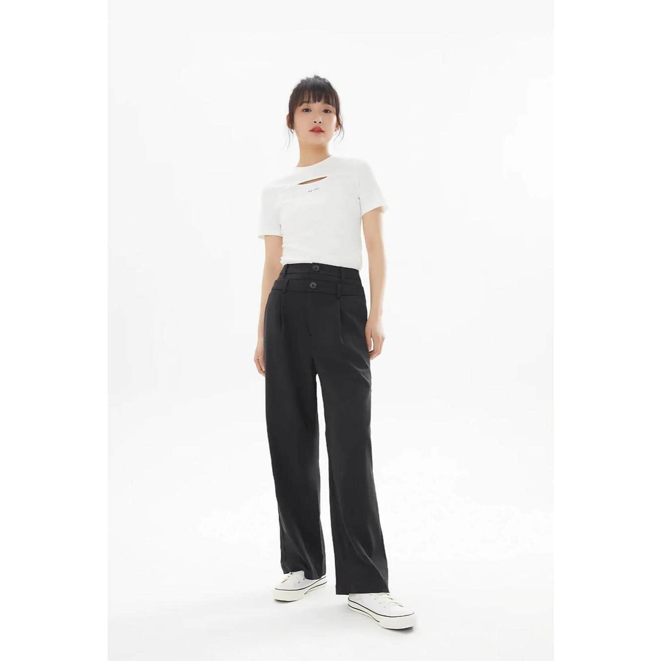 High-waisted black pants for women with a relaxed fit, featuring button details; paired with a trendy white distressed T-shirt, suitable for casual and streetwear styles.