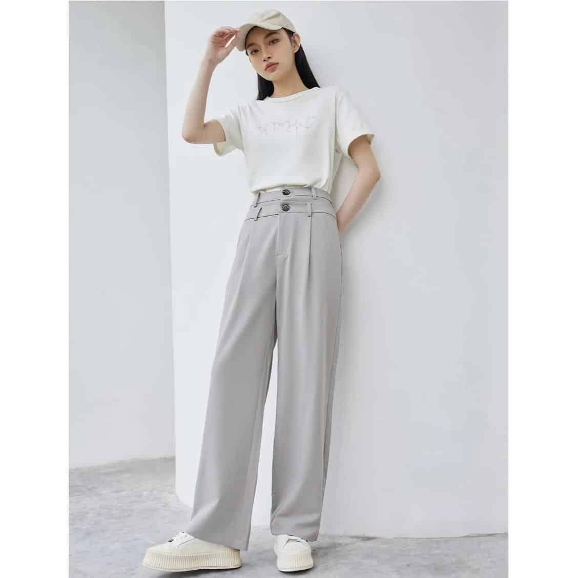 High-waisted light grey wide-leg pants with button details, perfect for stylish everyday wear.