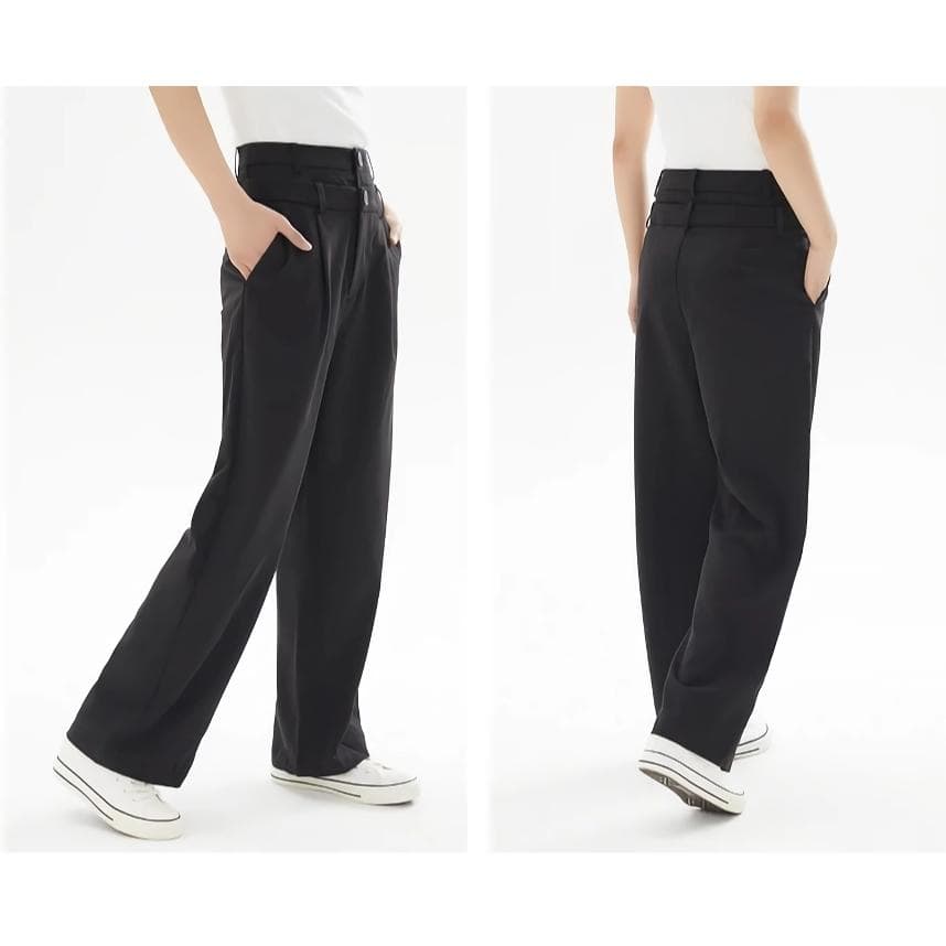 Comfortable black wide-leg trousers for women, perfect for casual or professional wear, featuring high waist, loose fit, and stylish design.