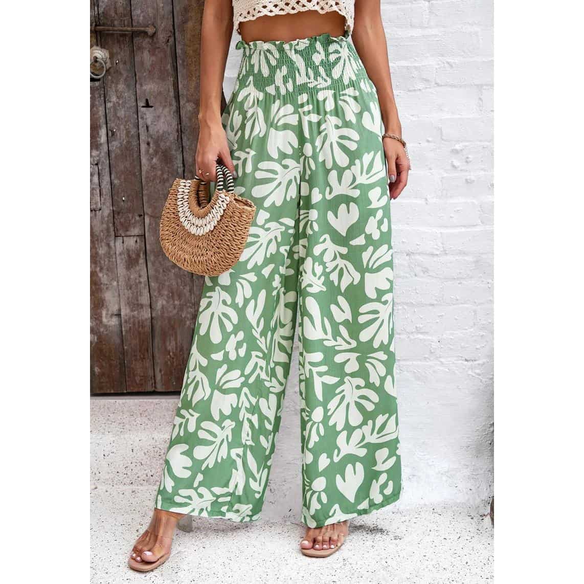 Stylish green and white tropical pattern wide-leg pants perfect for summer, vacation, or casual wear. Comfortable high-waisted design with flowy silhouette for a fashionable beach or resort look.
